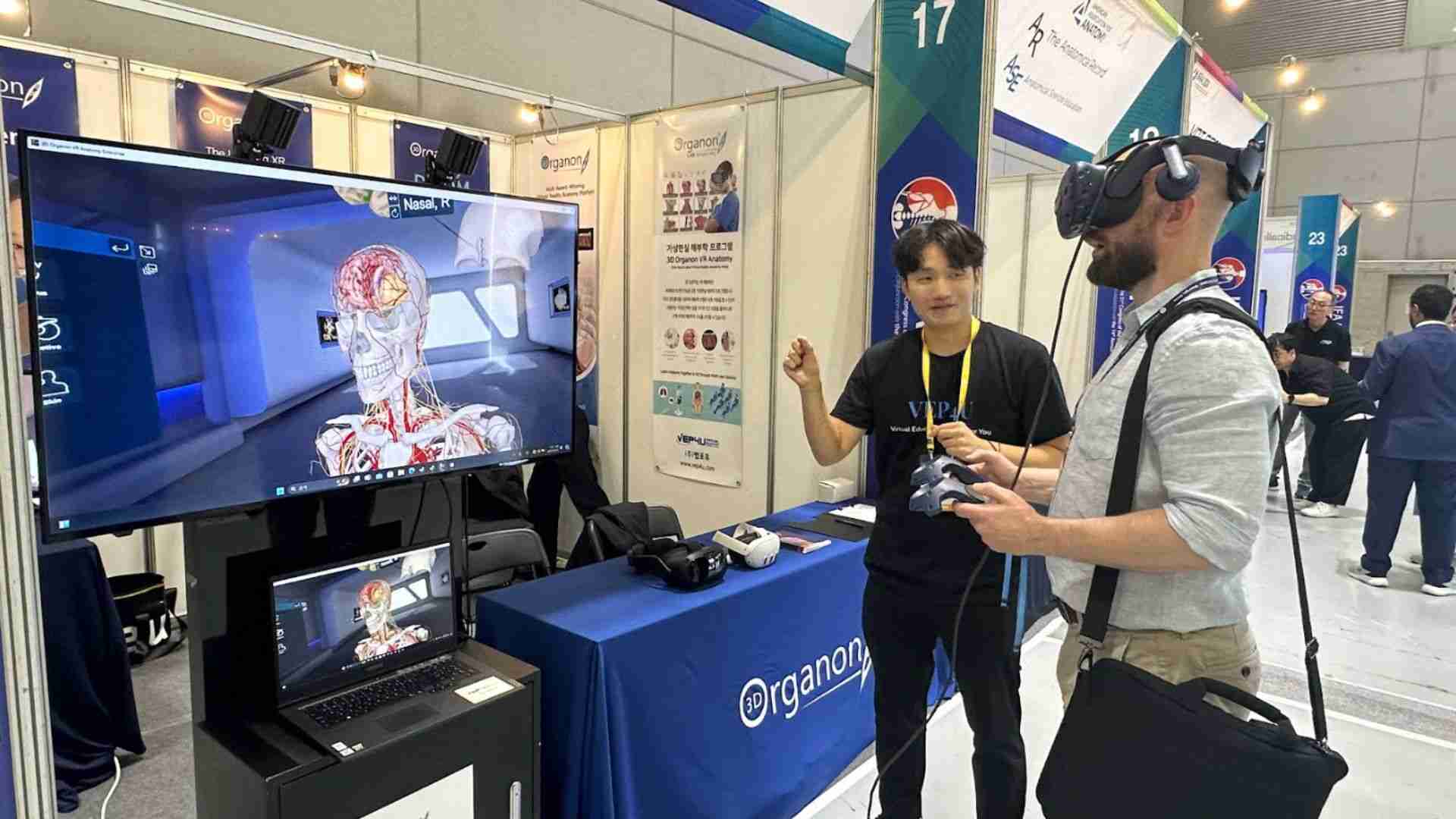 Day 1 at IFAA 2024 A vibrant scene from Day 1 at the 21st Congress of the International Federation of Associations of Anatomists (IFAA) 2024 in Gwangju, Korea. The 3D Organon booth is bustling with attendees, collaborators, and advisory board members engaging with interactive displays showcasing cutting-edge medical education technology. Visitors are seen exploring immersive 3D anatomy demos and discussing innovative ideas to advance anatomy education. The energy and excitement of the event are palpable, setting the stage for insightful conversations and breakthroughs in the field of medical education.